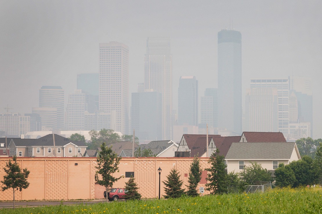 City of Minneapolis skyline on a poor air quality day. Smoke and haze obstructs the view of the city.