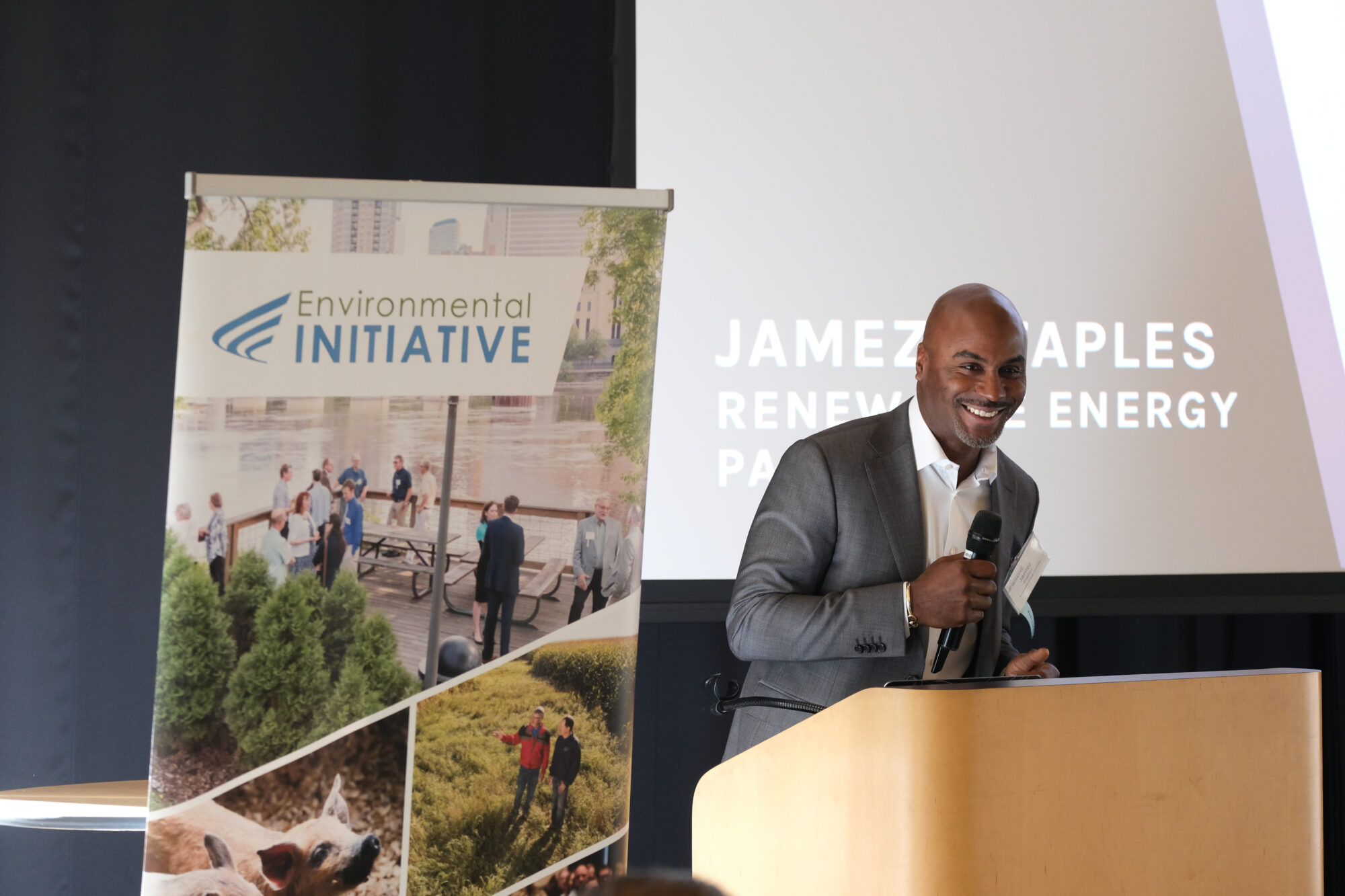 Jamez Staples of Renewable Energy Partners smiles at the podium.